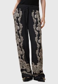 Sorte bukser med paisley-mønster i grå og hvid, med elastisk talje, sidelommer og et let design.