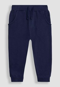 Navy blue sweatpants made of soft cotton with an elastic waistband, drawstring, two side pockets, and ribbed cuffs at the ankles.