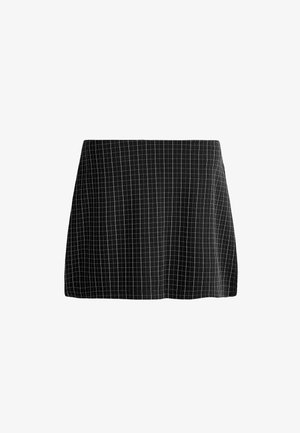 Mini-jupe noire avec motif à carreaux blancs, coupe droite et légère évasement en bas, présentée sur fond blanc.