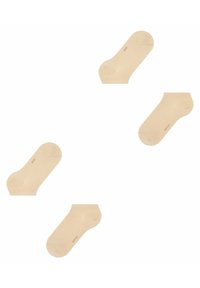 Beige Knöchelsocken aus einem glatten Material mit verstärkten Fersen und Zehen, die ein dezentes Markenlabel an der Seite haben.