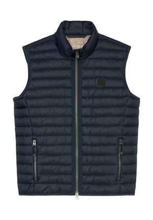 Merinovärinen tikkiliivi korkealla kauluksella, edessä vetoketjusuljenta ja kaksi sivuilla vetoketjullista taskua. Sisältää pienen logopatchin rinnassa.