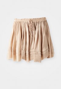 Light beige cotton skirt with an elastic waistband, drawstring detail, and layered ruffles. Soft texture with subtle stitching accents.