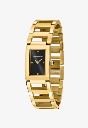 Orologio rettangolare in tonalità oro con quadrante nero, quattro piccoli diamanti e bracciale a maglie geometriche. Presenta una corona sul lato.