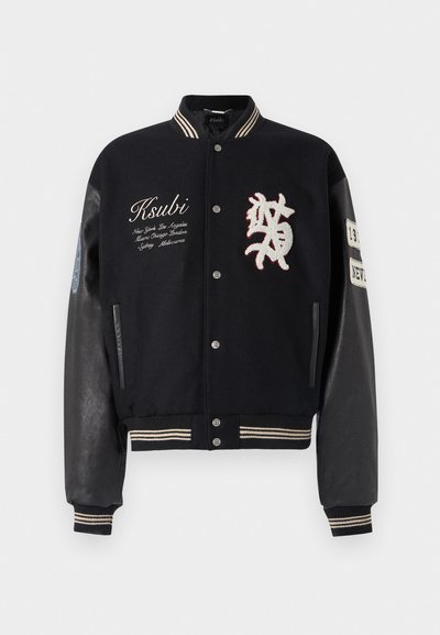 Black varsity jacket with wool body and leather sleeves, featuring embroidered logo and text details, striped ribbed collar, and cuffs.