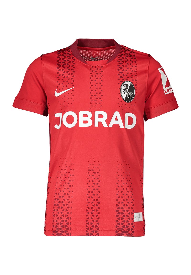 Maglia da calcio rossa con collo rotondo, maniche corte e un motivo a gradiente di triangoli. Presenta il logo "JOBRAD" e l'emblema della squadra sul petto.