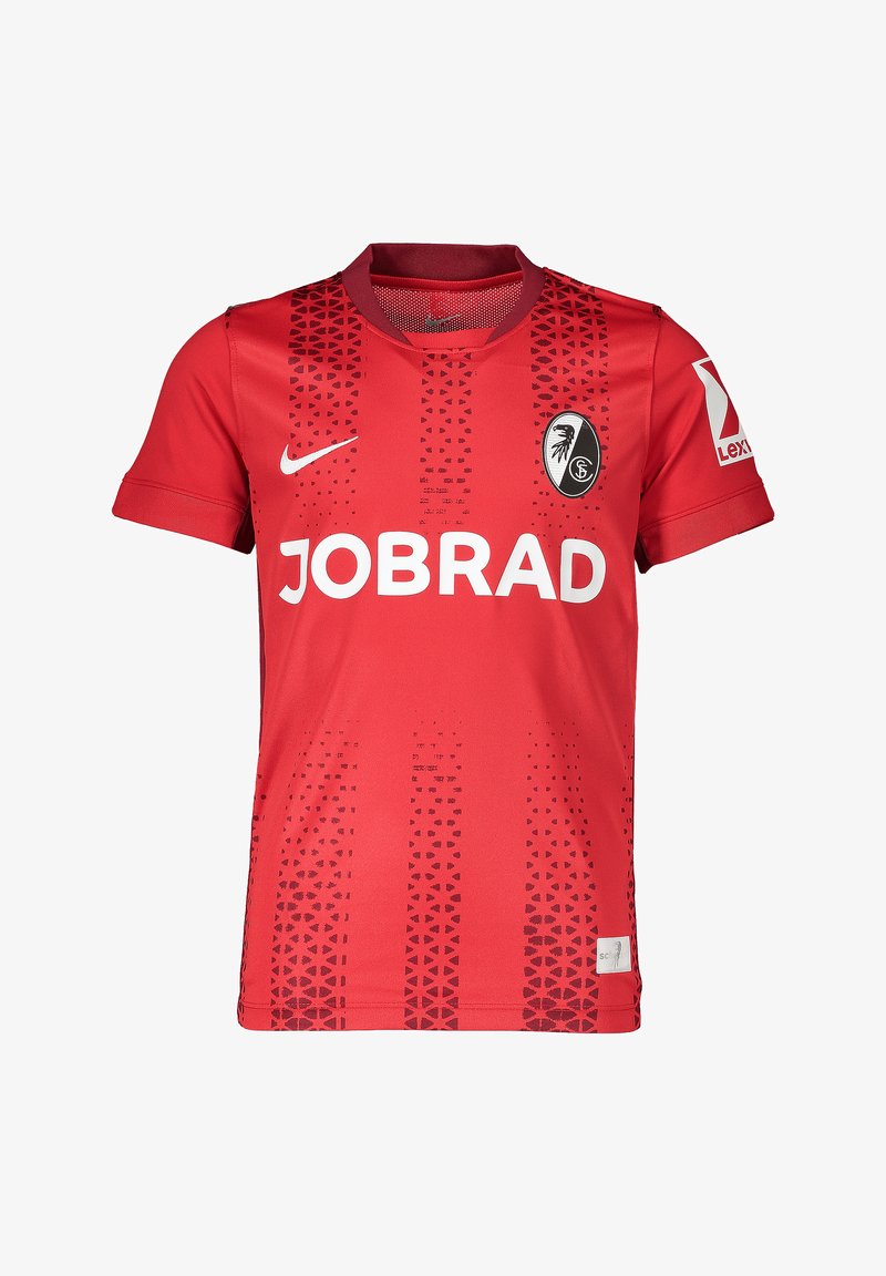 Maglia da calcio rossa con collo rotondo, maniche corte e un motivo a gradiente di triangoli. Presenta il logo "JOBRAD" e l'emblema della squadra sul petto.