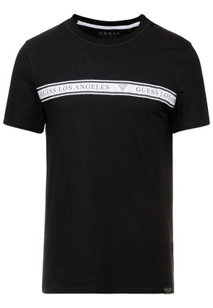 Czarny bawełniany t-shirt z białym poziomym paskiem z napisem "GUESS LOS ANGELES" i logo. Krótkie rękawy, okrągły dekolt oraz metka na dole.