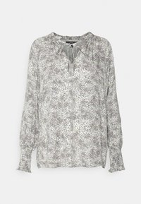 Blusa leve em branco e cinza com um padrão floral subtil. Apresenta um decote em V e mangas longas e bufantes com punhos elásticos.