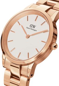 Rose gold metal watch with a white face, slender hour markers, and a polished bracelet. Features a round case and crown accent.