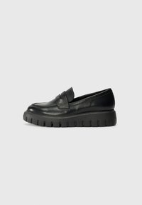 Black leather loafers with a rounded toe, elevated thick rubber sole, and a front strap detail. Smooth texture with minimal stitching.