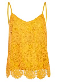 Haut au crochet jaune présentant un motif floral, des bretelles fines et un bord festonné. Le matériau a une apparence texturée, semblable à de la dentelle.