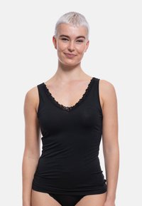 Black tank top with a V-neck design, featuring a lace trim. Made from a soft, stretchy material that fits closely to the body.