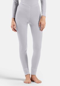 Light gray leggings made of ribbed knit fabric, featuring a fitted design, elastic waistband, and cuffed ankles.