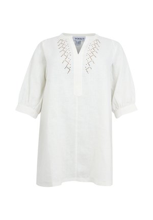 Weiße Leinenbluse mit dreiviertel Puffärmeln, V-Ausschnitt mit Blende und braunem Zickzack-Stick auf der Brust.