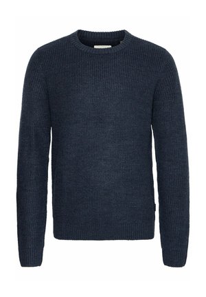 Donker marineblauwe gebreide trui met een geribbelde structuur, ronde hals en lange mouwen. Heeft een lichte zijsplit aan de onderkant en verstevigde manchetten.