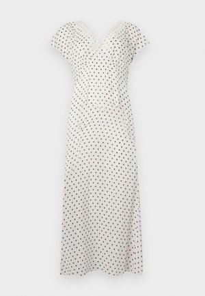 Robe midi blanche à pois marron, manches courtes, col en V et taille ajustée, présentée sur un fond uni.