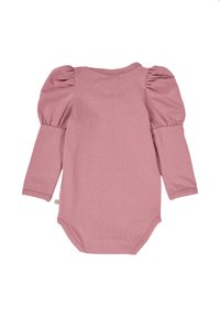 Long-sleeve bodysuit in soft, pastel pink fabric with puffed sleeves and a snap closure at the bottom for easy dressing. Smooth texture.