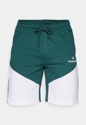 Green and white athletic shorts made of soft fabric. Features a drawstring waist and a diagonal split design with a logo on the front.