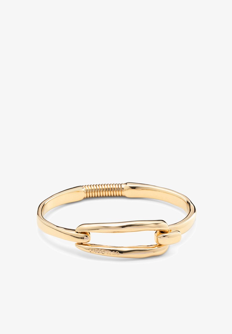 Bracelet doré avec un design maillé, présentant une surface lisse et un accent en spirale au centre. Style élégant et minimaliste.