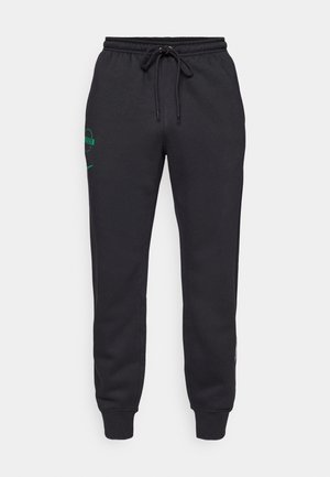 Pantaloni sportivi neri con vita elastica e polsini, logo verde vicino alla tasca sinistra e cordoncino in vita.