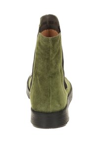 Green suede ankle boot with black side panels, round toe, and a textured black rubber sole. Features minimal stitching and a clean design.