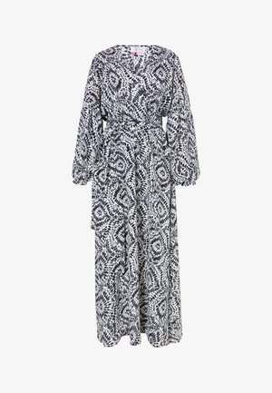 Lange wikkel jurk met een zwart-wit abstract patroon. Gemaakt van lichte stof met pofmouwen en een strikceintuur in de taille.