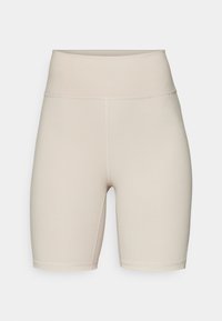Shorts da bici beige a vita alta realizzati in un tessuto liscio ed elastico. Presentano cuciture piatte e un taglio fino al ginocchio per comfort e libertà di movimento.