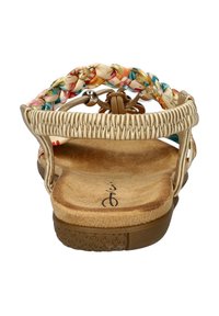 Gevlochten multicolor textiel sandalen met een gouden bovenkant. De kurken voetbed en rubberen loopzool hebben een gestructureerd patroon. Rugloze design.