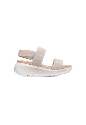 Sandale plateforme en daim beige avec deux larges brides et une semelle blanche épaisse, conçue pour le confort et un usage décontracté.