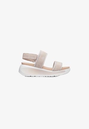 Sandale plateforme en daim beige avec deux larges brides et une semelle blanche épaisse, conçue pour le confort et un usage décontracté.
