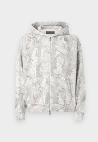 Hoodie in lichtgrijs met een natuur geïnspireerd patroon. Voorzien van een ritssluiting aan de voorkant, twee zakken en geribbelde manchetten. Zachte textuur.