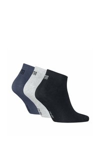Chaussettes de cheville en trois couleurs : bleu foncé, gris clair et noir. Fabriquées à partir d'un tissu texturé avec un design ajusté. Logo sur les poignets.