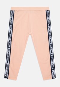 Pink leggings with navy side stripes featuring "GUESS LOVE" text and heart accents. Made from a soft, stretchy material for comfort.