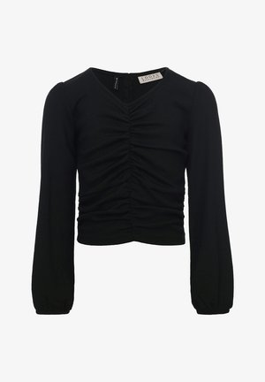 Blouse noire à manches longues raccourcie avec devant froncé, encolure en V et manches légèrement bouffantes, avec une étiquette LOOKS Revolution au col.