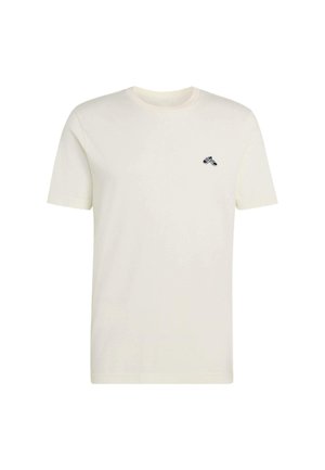 Bawełniana koszulka w kolorze kremowym z okrągłym dekoltem, krótkimi rękawami i małym czarnym logo na lewej piersi. Miękka w dotyku, casualowy design.