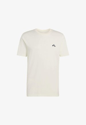 Bawełniana koszulka w kolorze kremowym z okrągłym dekoltem, krótkimi rękawami i małym czarnym logo na lewej piersi. Miękka w dotyku, casualowy design.