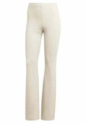Bež leggings s nogavicama koje se šire, glatke teksture, elastičnim pojasom i malim bijelim logom na lijevom kuku.