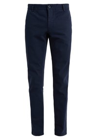 Granatowe bawełniane chinosy o slim fit, proste nogawki, z zapięciem na pojedynczy guzik i szlufkami na pasek. Gładka tekstura, brak widocznych wzorów.