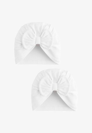 Kaks valget imikuturbaani pehmest kangast, kummalgi esiosal suur lips.