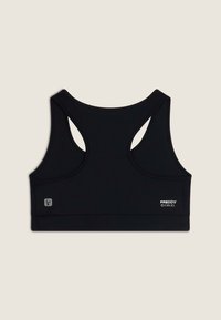 Svart idretts-BH med racerback-design, glatt stoff og logo-detalj på forsiden. Har en bred kant for støtte.