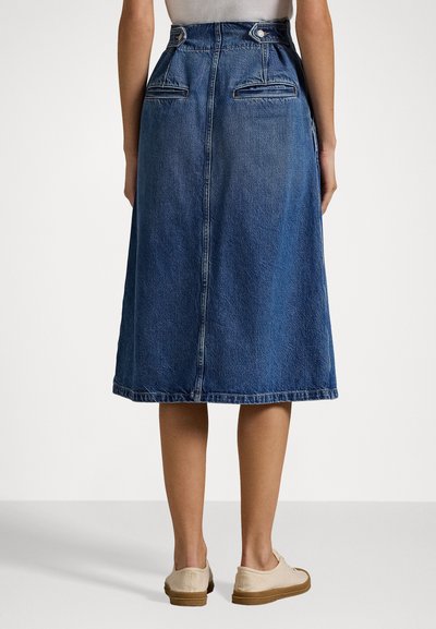 Mid-length denim skirt with a plain blue finish, back pockets, and a straight fit. It features a smooth texture and visible stitching.