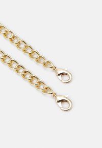 Two gold chain segments with oval links, each ending in a shiny lobster clasp on a white background.