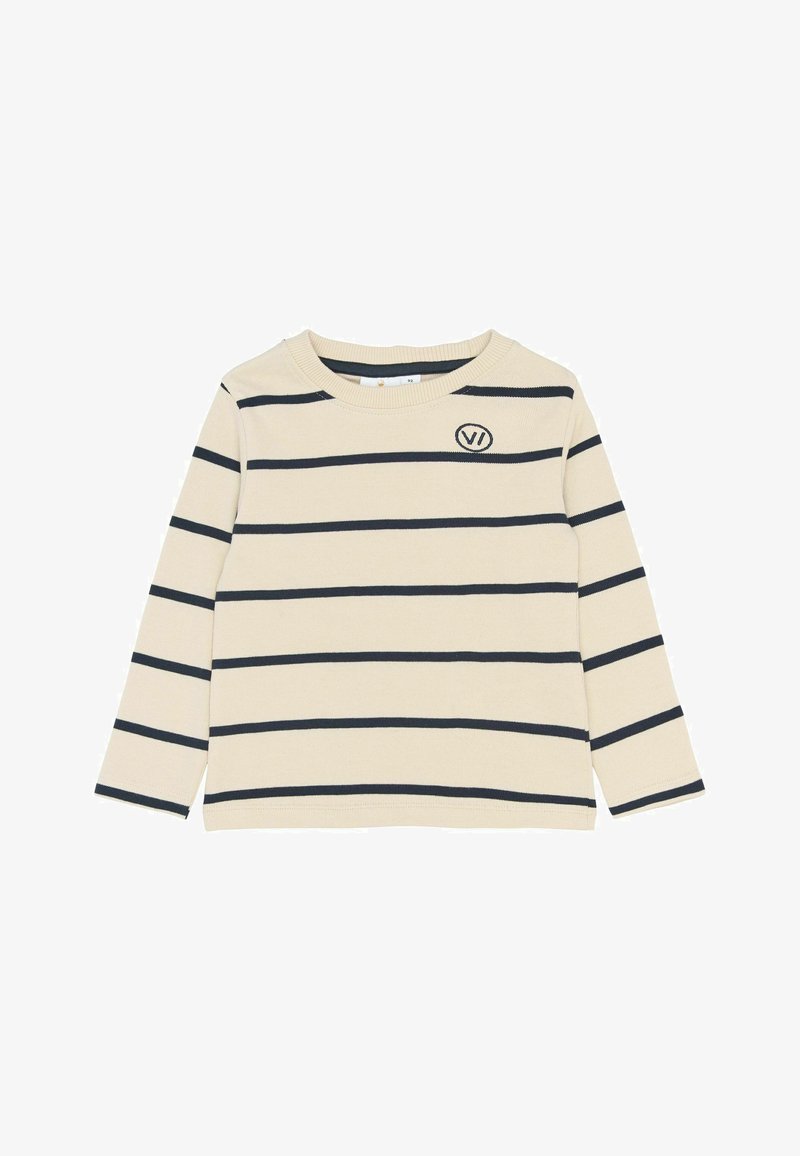 Kreminės spalvos ilgomis rankovėmis palaidinė su juodomis horizontaliomis juostelėmis ir mažu "VI" logotipu kairėje krūtinės pusėje.