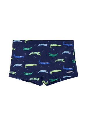 Bañador para niños en azul marino con patrones coloridos de cocodrilos en verde, azul y azul claro, pequeña etiqueta de la marca en el lateral.