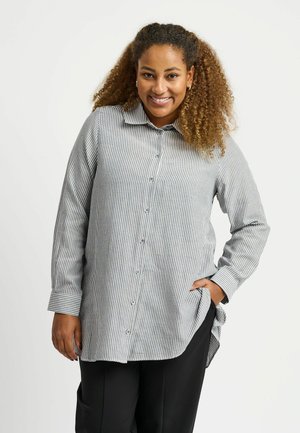 Striped button-up shirt in gray and white, with a spread collar, long sleeves, and side pockets. Features curved hem and regular fit.