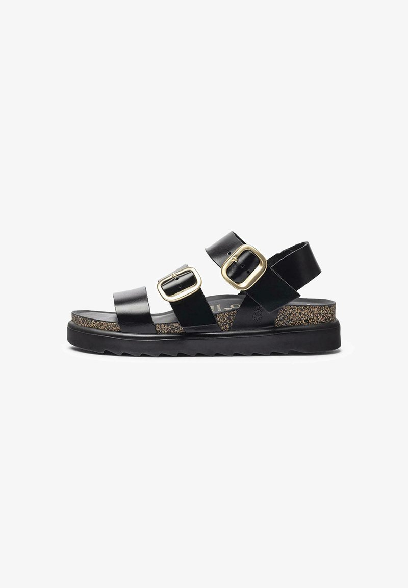 Black leather sandal featuring two buckle straps, a textured cork midsole, and a thick rubber sole with a zigzag pattern.