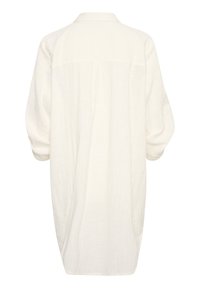 Robe chemise blanche à manches longues en tissu léger. Dotée d'un col, d'une coupe ample et d'un pli au dos. Design simple et minimaliste.