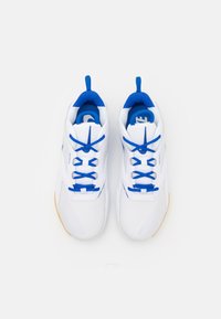 White athletic shoes with blue accents, featuring a mesh upper, blue laces, and a gum sole. Designed for comfort and performance.
