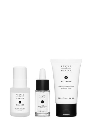 Three white Pestle & Mortar skincare products: Balance facial spritz, Pure Hyaluronic Serum dropper, and Hydrate lightweight moisturizer tube.