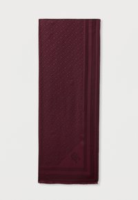 Burgundy scarf featuring a geometric pattern and solid borders. Smooth texture with frayed edges and a logo in one corner.